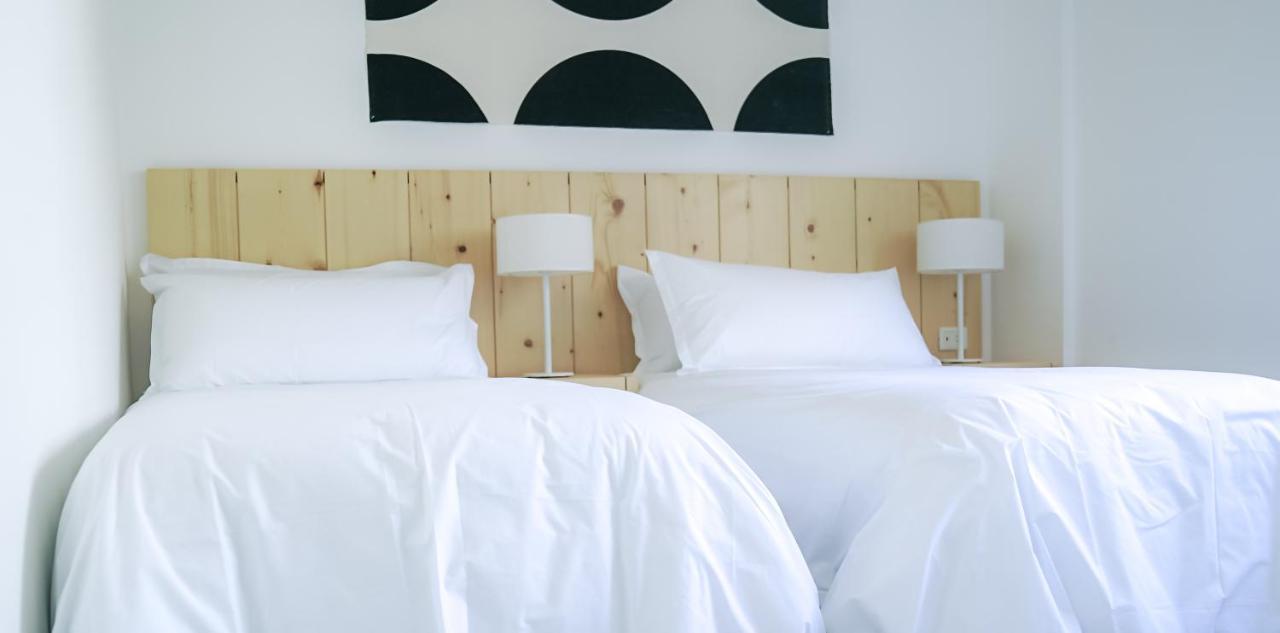 Casagrande Hotel & Beach Club خوسيه اجناسيو المظهر الخارجي الصورة A bed with white sheets